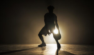 Male Basketball Player Silhouette Dribbling Ball